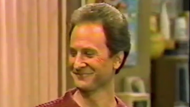 Cliff (Paul Regina) smiles in Brothers