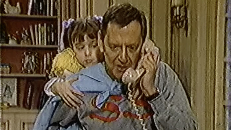 Sidney (Tony Randall) takes a phone call with Patti (Kaleena Kiff) on her back in Love, Sidney