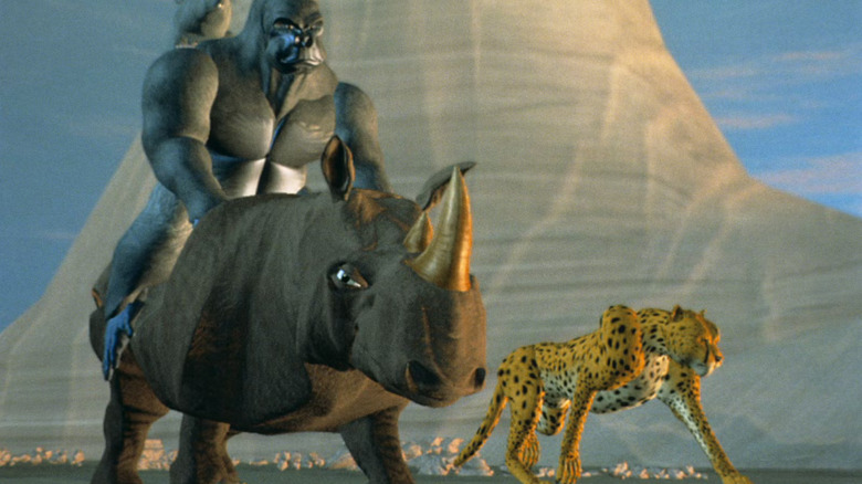 Optimus Primal, Rhionx and Cheetor stand in front of a mountain in Beast Wars