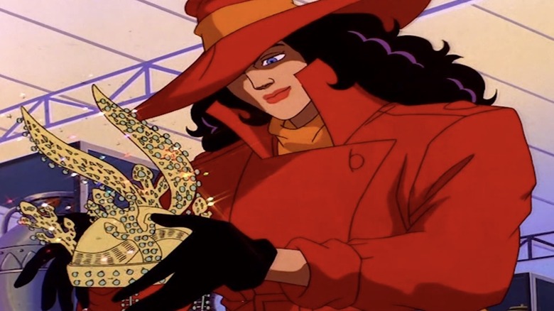 Carmen Sandiego looks at a gold ornament in Where on Earth is Carmen Sandiege?