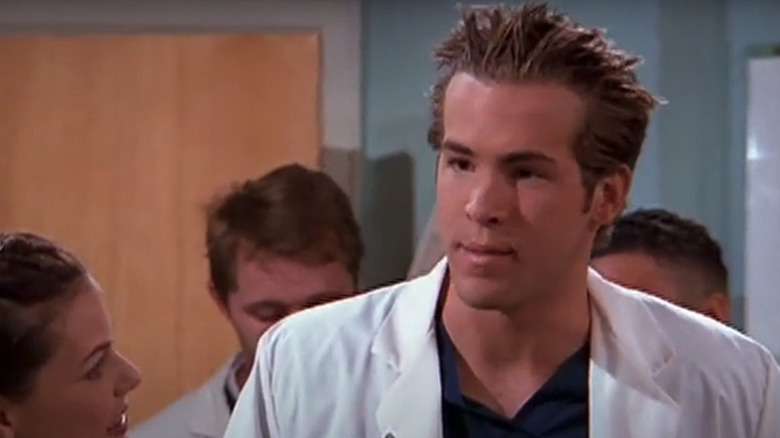 Berg (Ryan Reynolds) stands in the middle of a party in Two Guys and a Girl