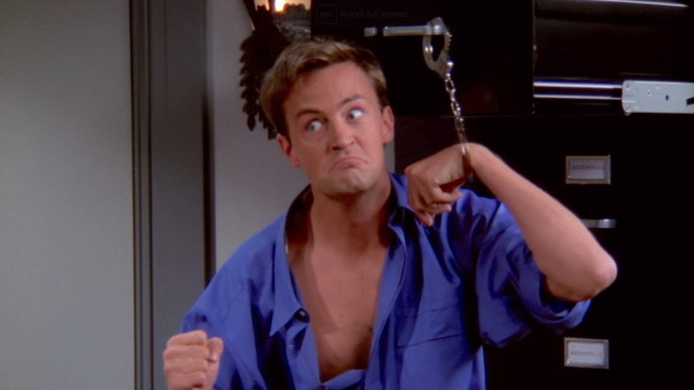 Chandler handcuffed to a file cabinet in Friends