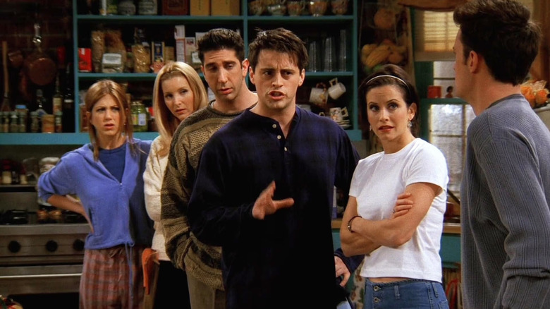 Rachel, Phoebe, Ross, Joey, and Monica staring angrily at Chandler in Friends