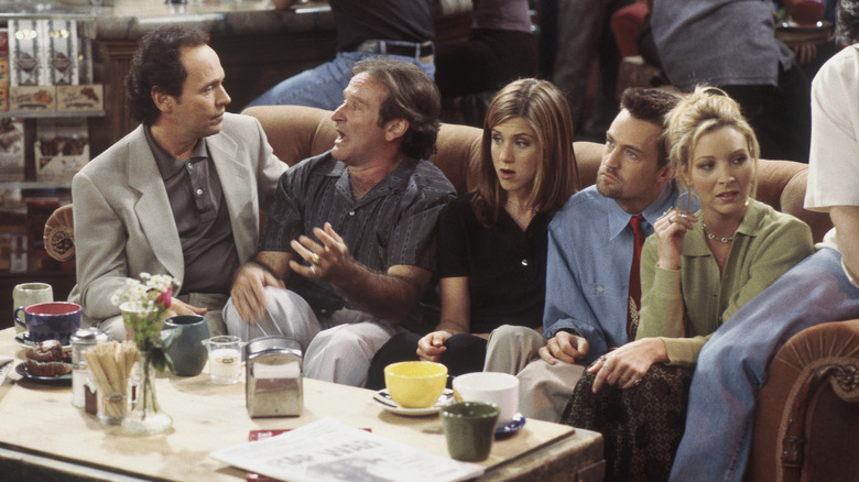 Tim and Tomas sitting next to Rachel, Chandler, and Phoebe on a couch in Friends