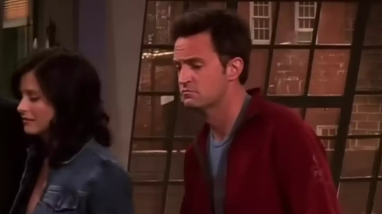 Monica and Chandler leaving their apartment in Friends