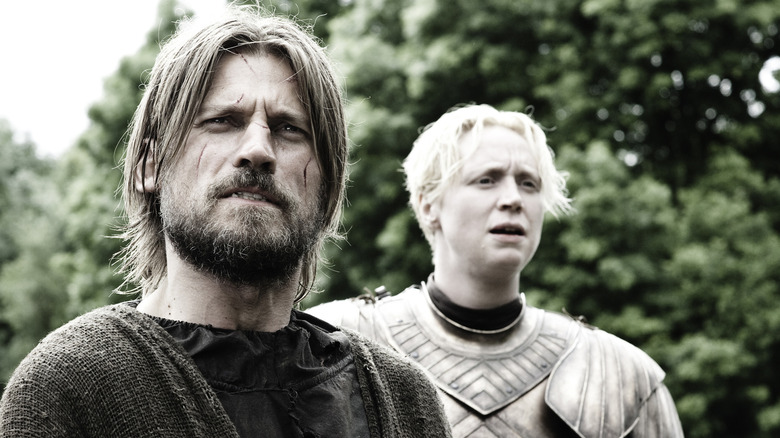 Nikolaj Coster-Waldau as Jaime Lannister looks confused next to Gwendoline Christie as Brienne of Tarth on Game of Thrones