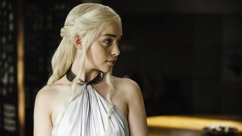 Emilia Clarke as Daenerys Targaryen looks over her shoulder on Game of Thrones
