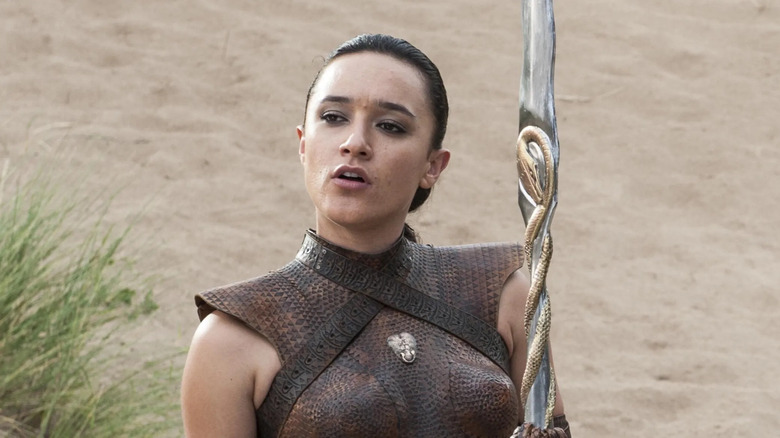 Keisha Castle-Hughes as Obara Sand stands in front of sand on Game of Thrones