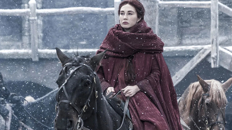 Carice van Houten as Melisandre rides a horse on Game of Thrones