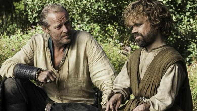 Iain Glen as Jorah Mormont sits next to Peter Dinklage as Tyrion Lannister on Game of Thrones