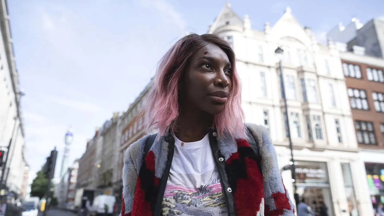 Arabella Essiedu (Michael Coel) stands in a London street in I May Destroy You