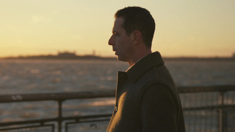 Jeremy Strong as Kendall Roy, looking out into the river in Succession.