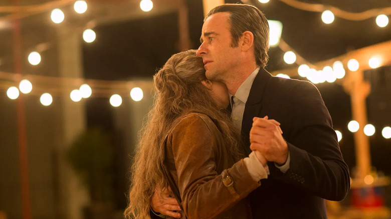 Carrie Coon as Nora Durst and Justin Theroux as Kevin Garvey, dancing together in The Leftovers.