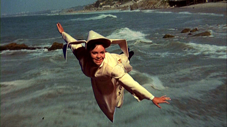 Sister Bertrille (Sally Field) soars above the coast in The Flying Nun