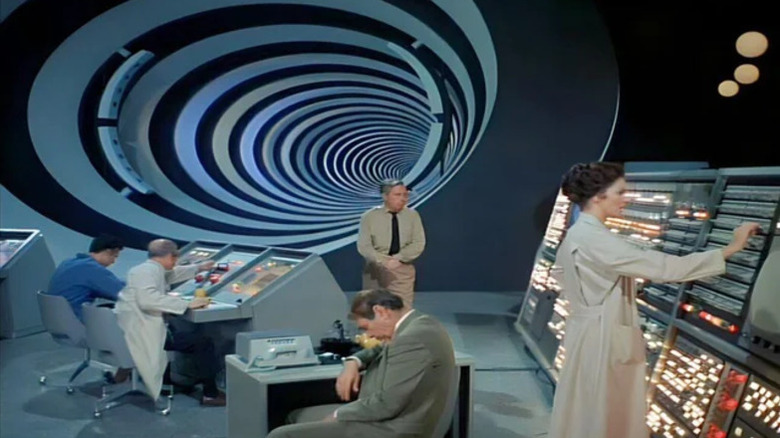 Ann MacGregor works on a console with a team of scientists by the Time Tunnel in The Time Tunnel