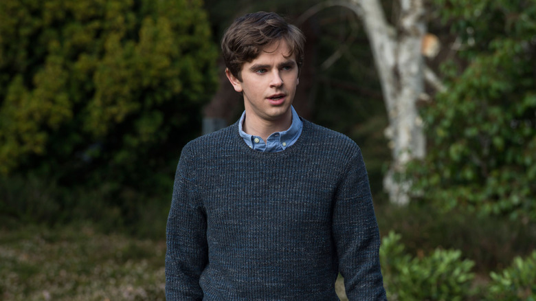 Norman Bates (Freddie Highmore) walks in the woods on Bates Motel