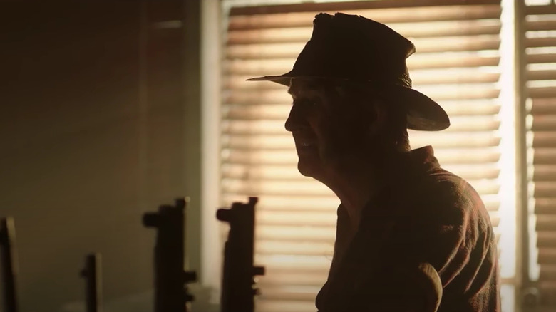 John Jarratt as Mick Taylor goes gun-shopping in season 2 of Wolf Creek