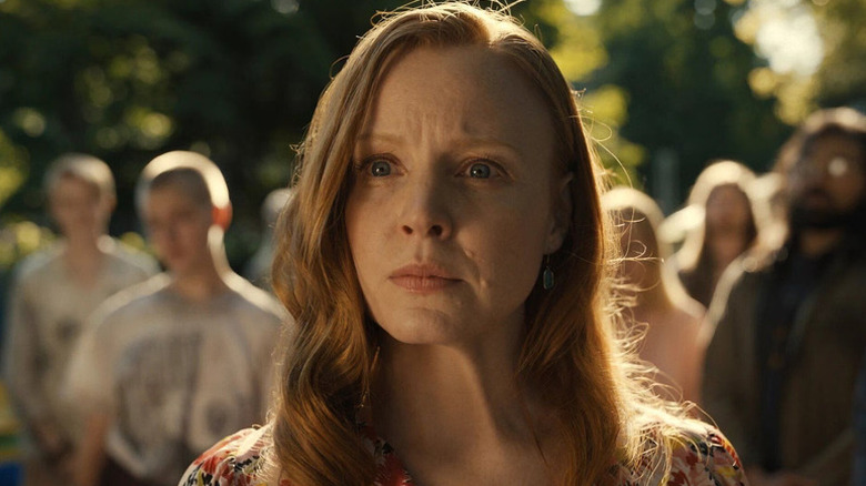 Dorothy Turner (Lauren Ambrose) stands in front of a cult in Servant