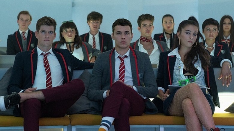 Group of students in uniforms sitting in classroom
