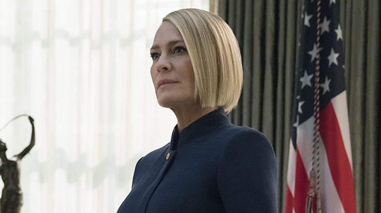 Claire standing in front of American flag