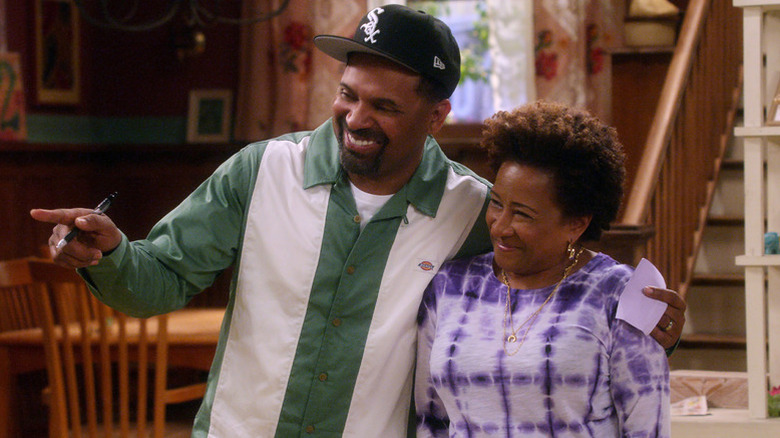 Bennie with arm around Lucretia, both smiling
