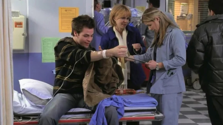 Levine sits next to Maggie Wyczenski and Dr. Abby Lockhart in ER