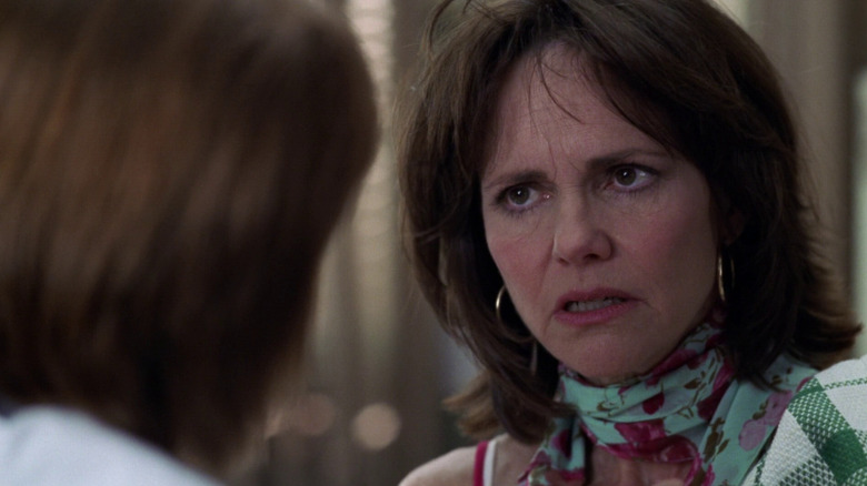 Maggie Wyczenski looks concerned in ER