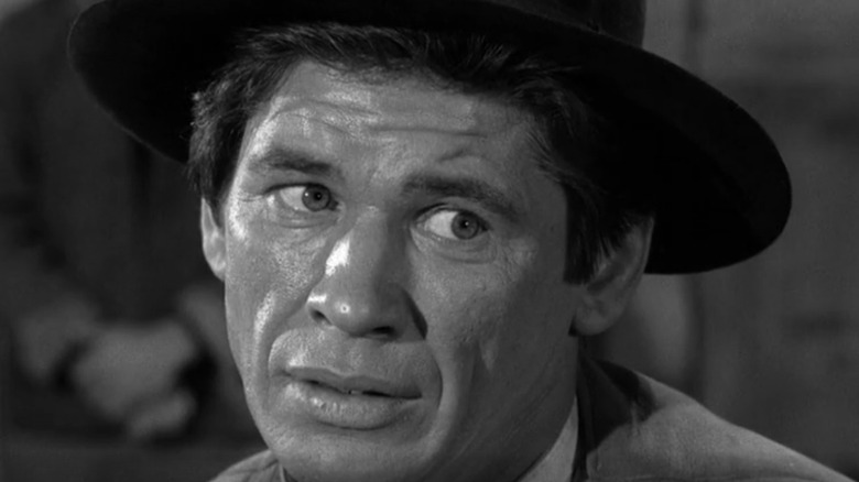 A sweaty Crego (Charles Bronson) looks wild-eyed in Gunsmoke
