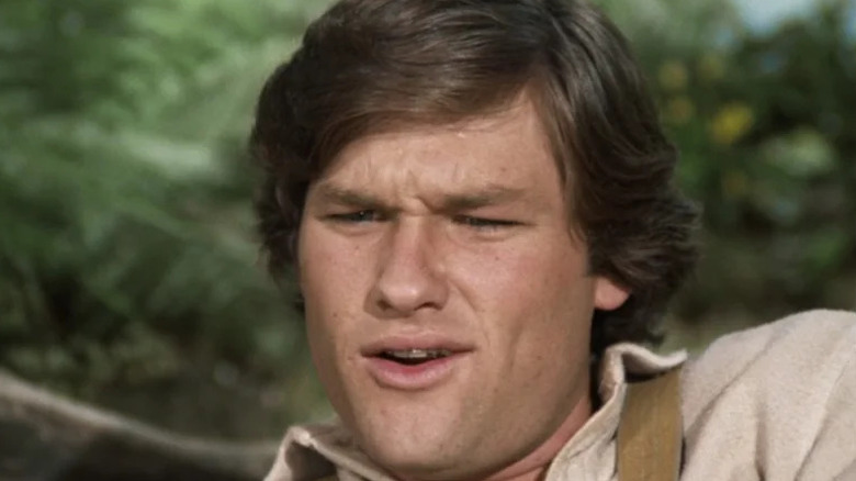 Buck Henry Woolfe (Kurt Russell) scoffs incredulously in Gunsmoke