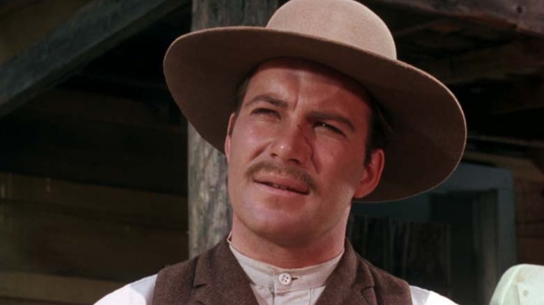 Fred Bateman (William Shatner) gazes upward in Gunsmoke