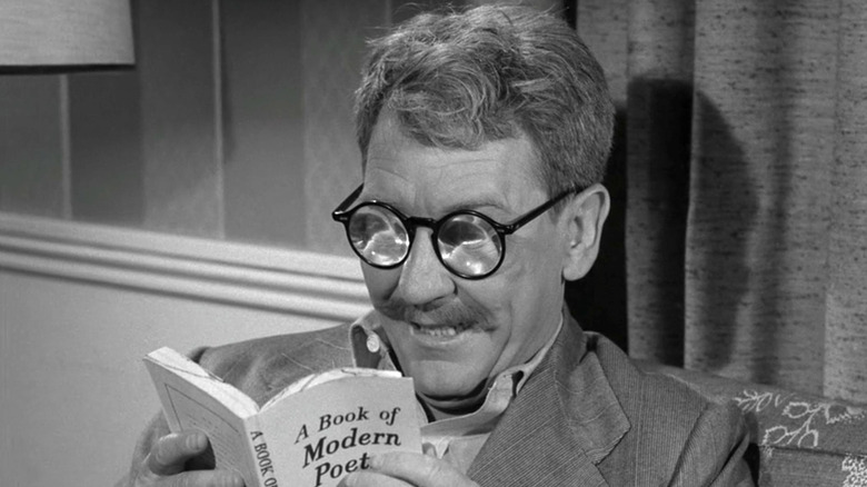 Henry Bemis (Burgess Meredith) tries to read in The Twilight Zone