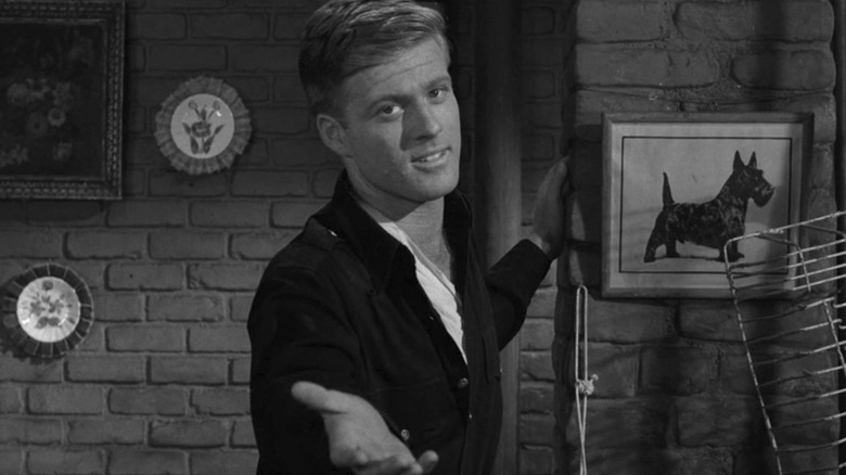 Harold Beldon (Robert Redford) holds out his hand in The Twilight Zone