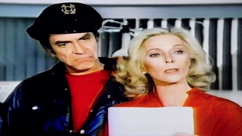 Martin Landau and Barbara Bain as JJ and Olga prepare their takeover of the resort, in The Harlem Globetrotters on Gilligan's Island.