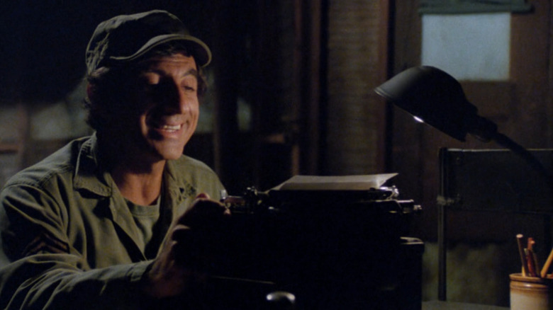 Max Klinger (Jamie Farr) writes a letter on a typewriter in M*A*S*H