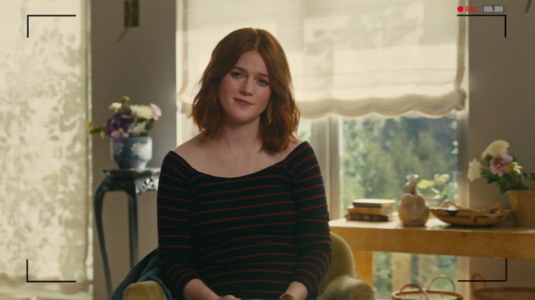 Rose Leslie as Clare staring at a recording camera in The Time Traveler's Wife