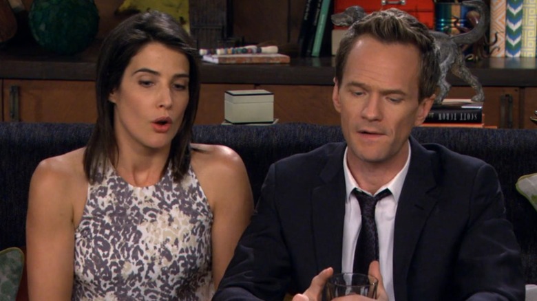 Cobie Smulders as Robin sitting with Neil Patrick Harris as Barney in How I Met Your Mother