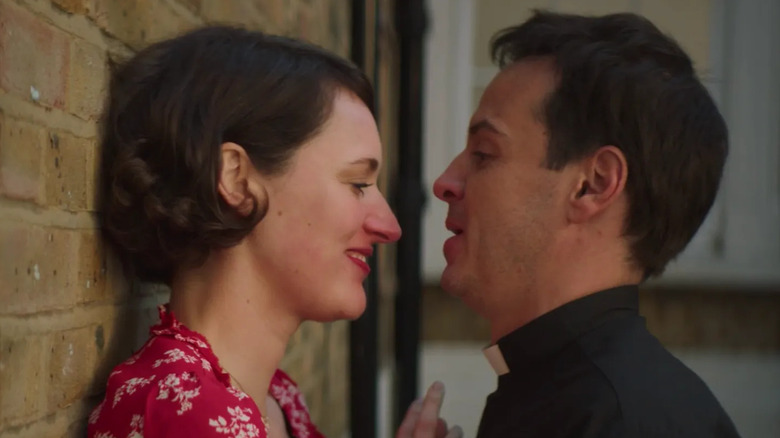 Phoebe Waller-Bridge as Fleabag against a wall facing Andrew Scott as Priest in Fleabag