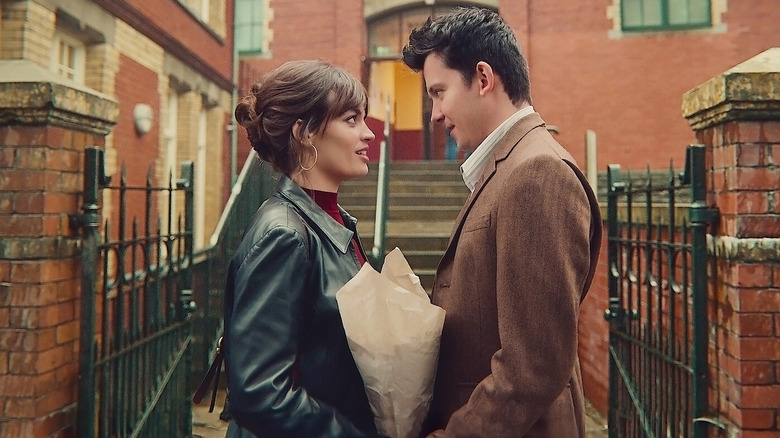 Emma Mackey and Asa Butterfield as Maeve and Otis facing each other in Sex Education