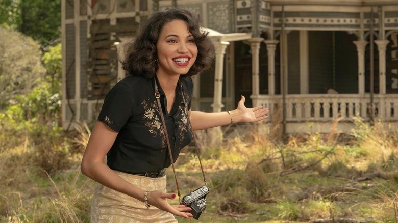 Jurnee Smollett as Letitia "Leti" Lewis, showing off an old house in Lovecraft Country.