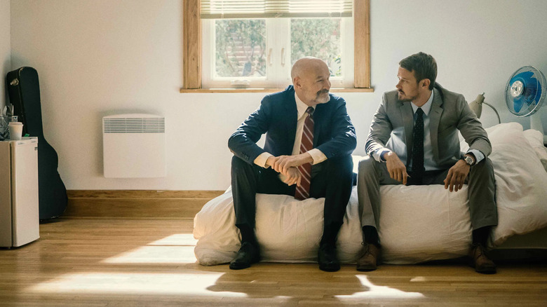 Terry O'Quinn as Tom Tavner and Michael Dorman as John Tavner, sitting on an air mattress in Patriot.