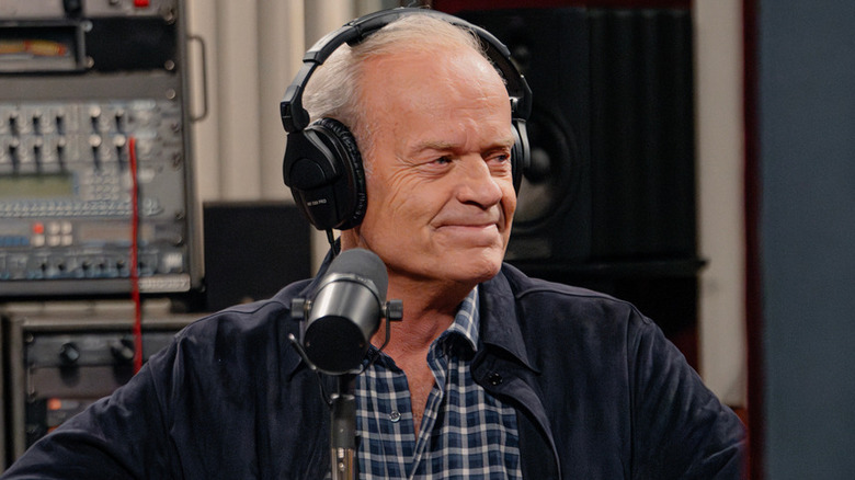 Kelsey Grammer as Frasier Crane wearing headphones in Frasier