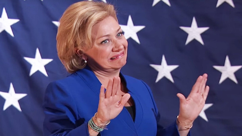 Nicole Sullivan as Hillary Clinton holding up her hands on MADtv