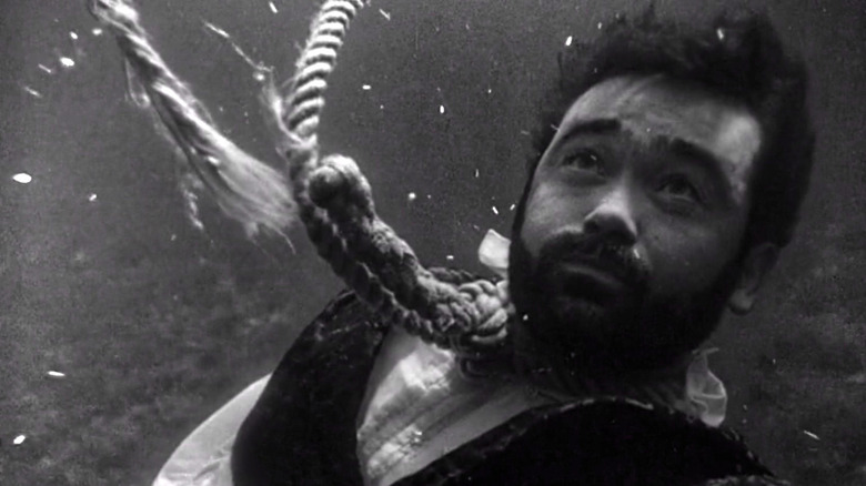 Peyton Farquhar (Roger Jacquet) sinks underwater with a broken noose around his neck in The Twilight Zone (1959)