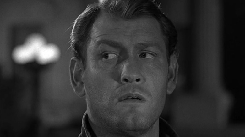 Mike Ferris (Earl Holliman) glances uneasily to his right in The Twilight Zone (1959)
