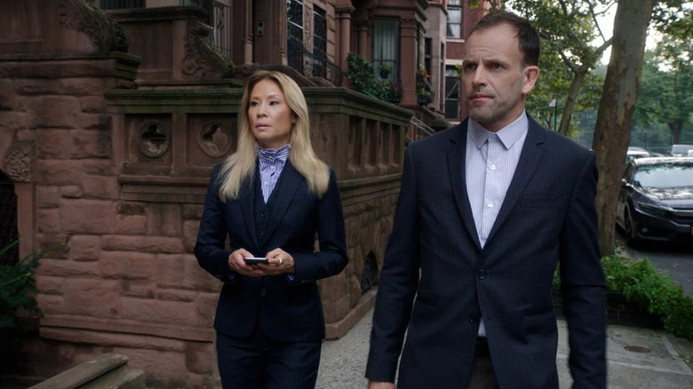 Watson (Lucy Liu) and Holmes (Jonny Lee Miller) standing on the street on "Elementary."