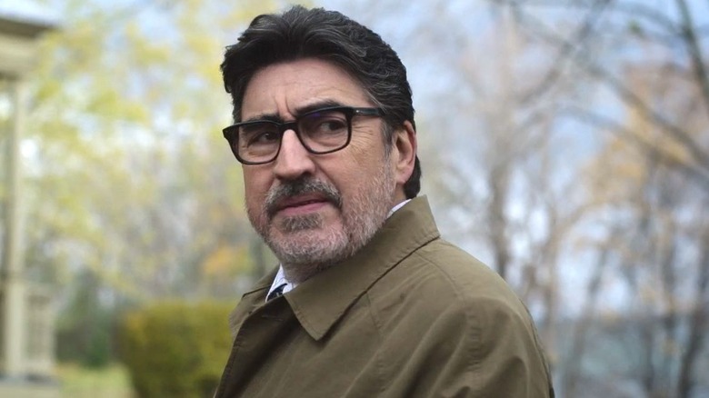Armand Gamache (Alfred Molina) standing outside on "Three Pines."