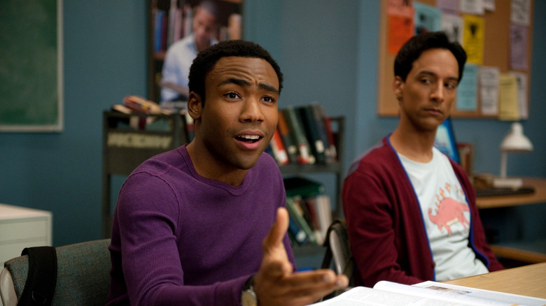 Donald Glover as Troy Barnes argues next to Danny Pudi as Abed Nadir in Community