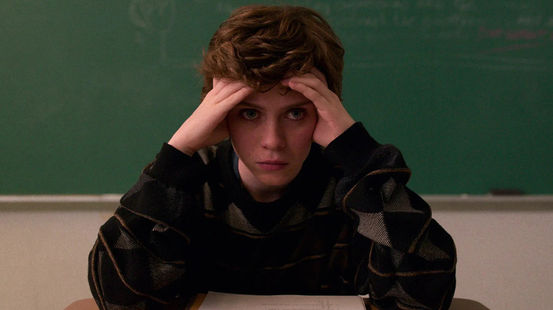 Sophia Lillis as Sydney Novak holding her head in her hands in I Am Not Okay With This