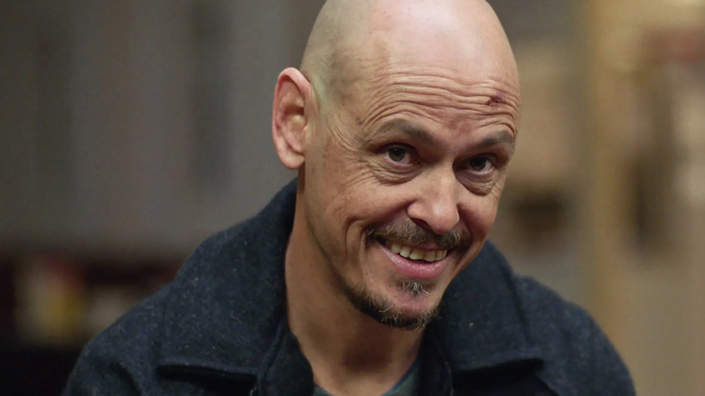 Ray (Scott Ryan) smiling on "Mr. Inbetween."