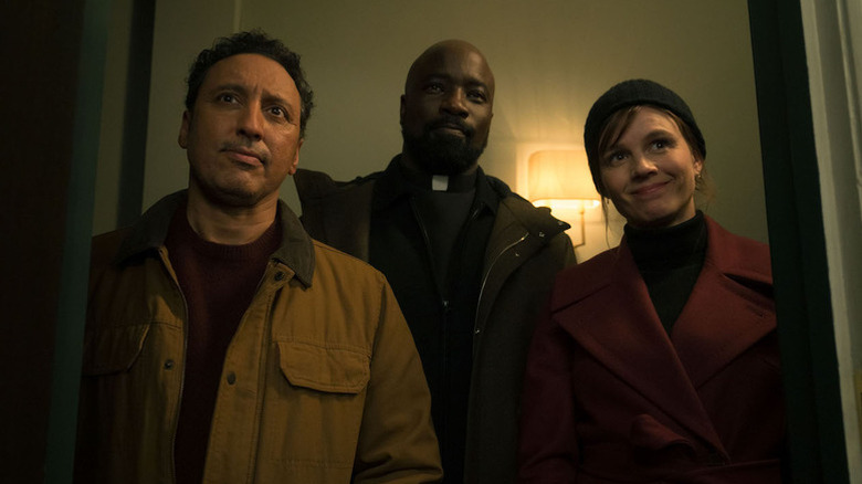 Aasif Mandvi as Ben, Mike Colter as David, and Katja Herbers as Kristen standing in doorway in Evil